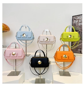 Multiple candy-colored vintage mini handbags in premium leather with gold locks