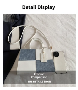Flat lay of a two-tone patchwork bag in white PU leather and blue denim with straps