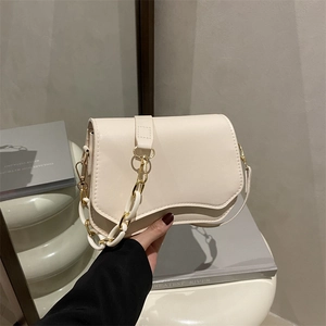 Chic cream leather flap bag with wavy edge design and gold chain strap for women