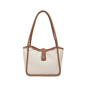 Chic two-tone cream and brown tote bag with shoulder strap and magnetic buckle