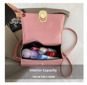 Detail view of pink flap bag interior showing capacity for umbrella, wallet, and lipstick