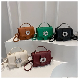 Close-up of five colored crossbody bags featuring luxury square rhinestone buckles on flap