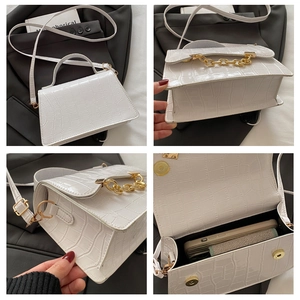 Detailed views of a white crocodile pattern small square bag with gold chain and strap