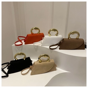 Close-up of asymmetrical flap bags with liquid gold metal handles in five vibrant colors