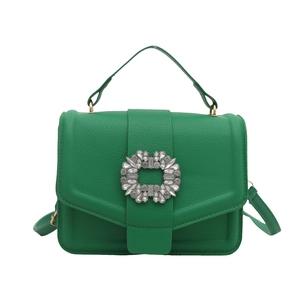 Elegant green leather handbag with sparkling rhinestone buckle and long shoulder strap