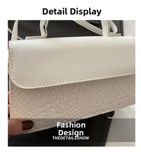 Detailed view of the white PU leather handbag featuring woven texture and precise stitching