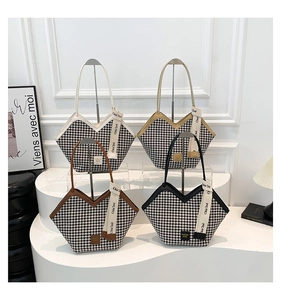 Detailed view of four plaid tote bags in beige, yellow, brown, and black with V-cut design