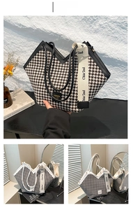 Detail of large houndstooth tote bag with V-shaped opening and wide canvas strap