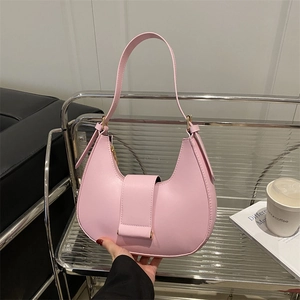 Pink minimalist half-moon hobo bag with magnetic closure and metallic hardware