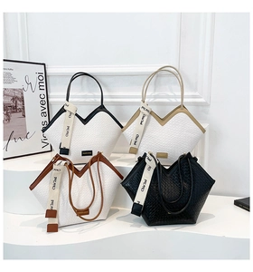 Detailed view of assorted woven tote bags featuring unique V-shaped openings and stylish ribbons