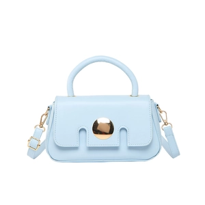 Light blue faux leather crossbody bag with distinctive notched flap and gold metal buckle