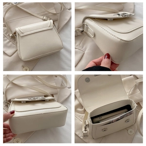 Detail view of cream PU leather crossbody bag showing stitching, bottom and interior storage