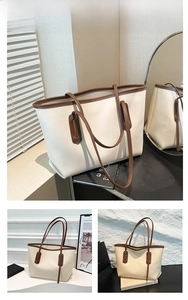 Détails du grand sac cabas en cuir blanc cassé avec bordure marron foncé et anses