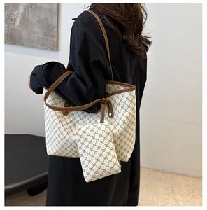 Detail of vintage pattern tote bag and matching pouch showing large capacity and handles