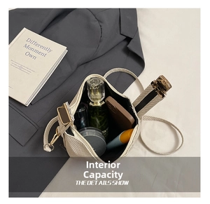 Internal capacity of beige woven crossbody bag showing phone and cosmetics space