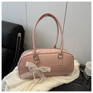 Pink Boston handbag featuring elegant pearl lace bow and silver hardware detail