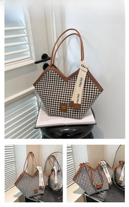 Detail of houndstooth tote bag featuring brown leather trim and V-cut design details