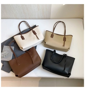 Vue à plat de grands sacs fourre-tout en cuir en quatre couleurs neutres pour femmes actives