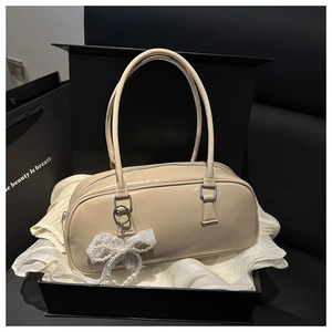Lacquered leather Boston bag in gift box with lace bow and pearl charm detail