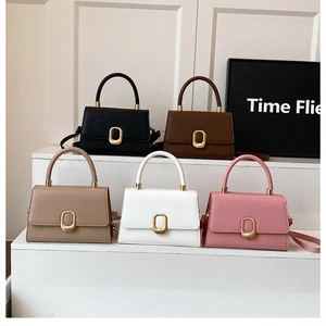 Group display of chic crossbody bags in five colors with elegant gold metal buckles