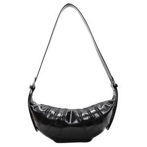 Classic black croissant bag with glossy finish and quilted crescent shape on white background
