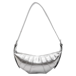 Retro silver metallic crescent croissant bag with a minimalist paneled design and shoulder strap