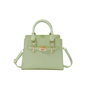 Elegant mint green trapezoid handbag with gold turn-lock and adjustable shoulder strap