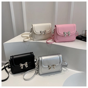 Group shot of stylish bow-knot flap bags in white, pink, black and silver colors
