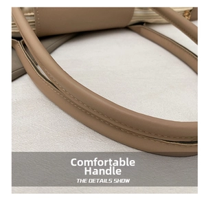 Gros plan d'une poignée confortable sur un sac cabas beige avec coutures doublées