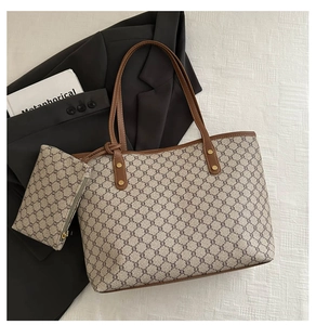 Close-up of vintage tote bag set featuring geometric patterns and golden metal rivets
