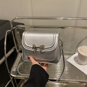Silver metallic bow crossbody bag for women with polished finish and chic square design