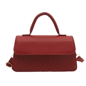 Classic red flap shoulder bag in vegan leather with textured snake pattern and gold hardware