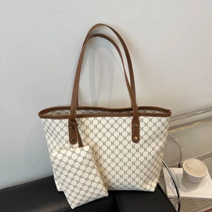 Retro cream and brown monogram tote bag set with matching pouch on black leather