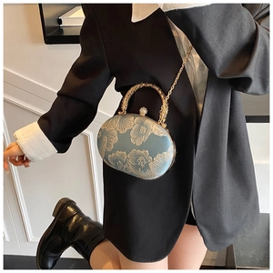 Vintage light blue embroidered sphere evening bag with gold floral patterns and metal handle