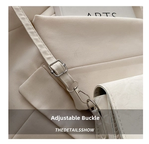 Close-up of white PU leather strap with silver metal adjustable buckle and hook