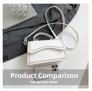 Close-up of white leather handbag featuring unique brown wavy stitching and long shoulder strap