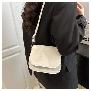 Detail of white marble pattern crossbody bag with Fashion Trend EST 1996 text print