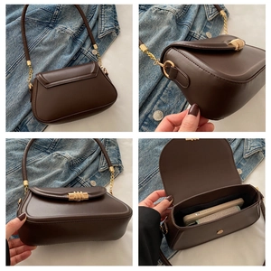 Detail view of small crossbody square bag with gold twist lock and interior storage space