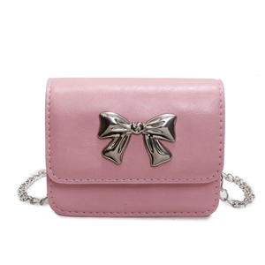 Pink leather mini crossbody bag with silver bow accent and metal chain strap