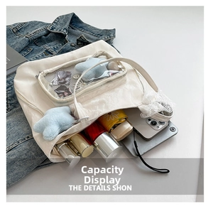 Detail view of large nylon tote bag with clear window compartment for accessories