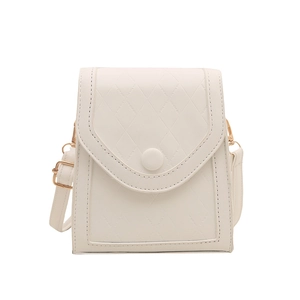 Minimalist white quilted cell phone crossbody bag with gold hardware on white background