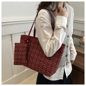 Detail of burgundy tweed tote bag with matching mini pouch and leather handles