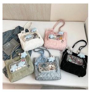 Detail view of five assorted colorful tote bags with star plush and lace handles