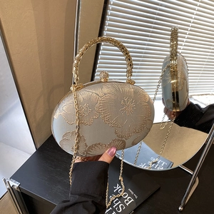 Elegant oval evening clutch with floral embroidery and gold metal handle for women