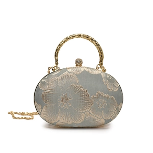 Elegant grey satin clutch with gold floral embroidery and circular metal handle