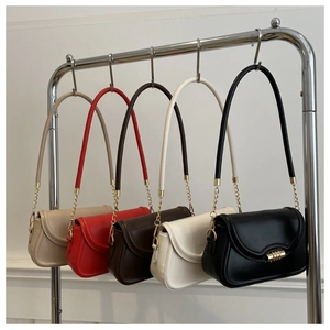 Detailed display of five colorful leather crossbody bags with gold metal chain straps