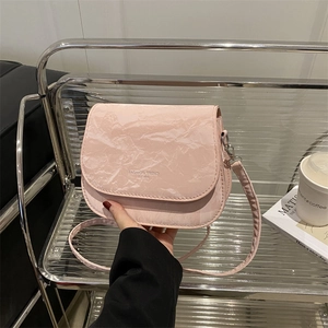 Pink saddle bag with marble pleated texture and crossbody strap for women