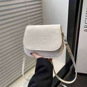 Chic cream saddle crossbody bag with pleated texture and thin shoulder strap for women