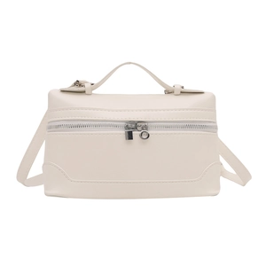 Minimalist creamy white vanity handbag with top handle and silver hardware in front view