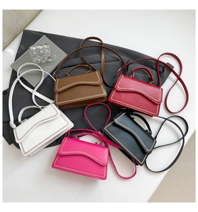 Top view of five colorful square crossbody bags with wave edges and decorative stitching